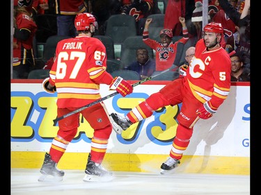 The Calgary Flames celebrate Mark Giordano's goal  on Montreal Canadiens goaltender Al Montoya during NHL action at the Scotiabank Saddledome on Thursday March 9, 2017.
GAVIN YOUNG/POSTMEDIA NETWORK