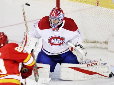 Sean Monahan's shot is deflected by Montreal Canadiens goaltender Al Montoya during third period NHL action at the Scotiabank Saddledome on Thursday March 9, 2017.
GAVIN YOUNG/POSTMEDIA NETWORK
