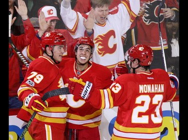 Calgary Flames (l-r) Micheal Ferland, Johnnie Gaudreau and Sean Monahan celebrate Ferland's goal on Montreal Canadiens goaltender Al Montoya during NHL action at the Scotiabank Saddledome on Thursday March 9, 2017.
GAVIN YOUNG/POSTMEDIA NETWORK