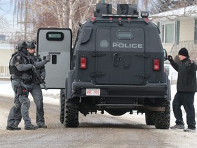 Calgary police tactical officers arrest a bank robbery suspect from a house on Danloe St. in Renfrew on Monday March 17, 2017. GAVIN YOUNG/POSTMEDIA NETWORK
