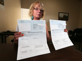 Darlene Piche holds the carbon tax rebate her mom received along with the bill for it's return after she passed away this past January. At least three Alberta families say they've been issued bills from the province to return carbon tax rebates after loved ones died. Piche was photographed in Strathmore on Tuesday March 14, 2017. GAVIN YOUNG/POSTMEDIA NETWORK