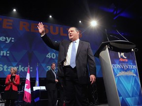 Jason Kenney waves to the crowd after winning the Alberta PC leadership in Calgary on Saturday.