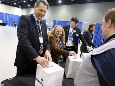 Richard Starke and his wife Alison casts their votes with their sons during the PC leadership convention in downtown Calgary on Saturday March 18, 2017.