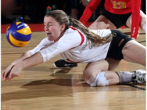 University of Calgary Dinos' Kate Pexman digs a ball against the UBC Okanakan Heat during the Canada West playoffs at the Jack Simpson Gym Friday, March 3, 2017. {David Moll}