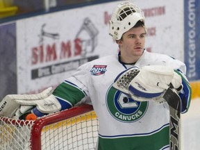 Calgary Canucks goaltender Logan Drackett takes a breather in between plays during AJHL action against the Fort McMurray Oil Barons at the Casman Centre in Fort McMurray Alta. on Saturday January 14, 2017. The Canucks face the Drumheller Dragons in the first round of the AJHL playoffs.