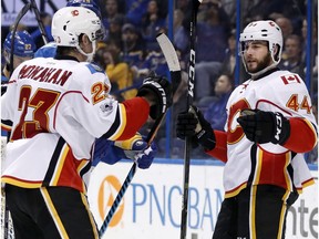 Calgary Flames' Matt Bartkowski (44) is congratulated by Sean Monahan after scoring against the St. Louis Blues on Saturday, March 25, 2017, in St. Louis. The Flames won 3-2 in overtime. (AP Photo)