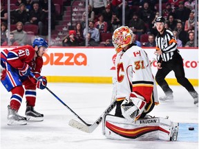 Chad Johnson #31 of the Calgary Flames allows a short handed goal in the second period during the NHL game against the Montreal Canadiens at the Bell Centre on January 24, 2017 in Montreal, Quebec, Canada.