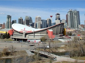 The Saddledome stands out against the Calgary skyline seen from Scotsman's Hill Wednesday April 13, 2016. The City has hired a consultant to study future uses for the site. (Ted Rhodes/Postmedia)