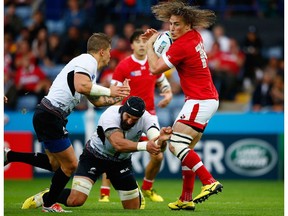 Jeff Hassler of Canada breaks through the Romania defence as he scores their second try during the 2015 Rugby World Cup Pool D match between Canada and Romania at Leicester City Stadium on October 6, 2015 in Leicester, United Kingdom. Canada will play two exhibition matches in Alberta as a tune up for qualifying for the 2019 Rugby World Cup in Japan.