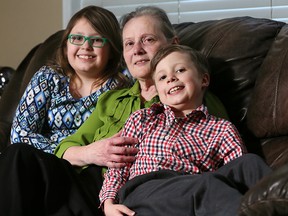 Carson Gerbrandt with grandmother Flora and sister Harmony at home on Tuesday.
