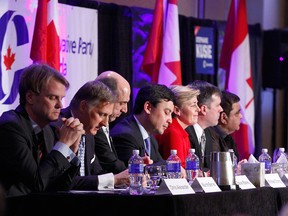 Candidates wait for the start at a Conservative party leadership candidate forum at the Deerfoot Inn and Casino in Calgary on Wednesday March 1, 2017.
