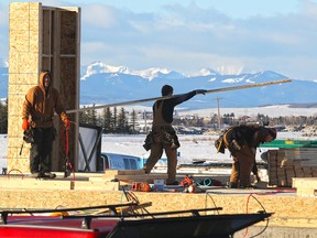 Framers work on new home construction on the western edge of Calgary.