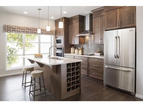The kitchen in the Maxwell duplex by Excel Homes in Savanna in Saddle Ridge.