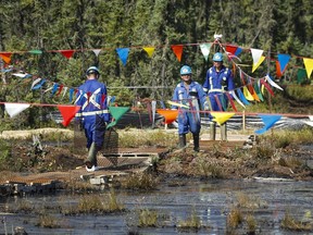 Crews work to contain and clean up a pipeline spill at Nexen Energy's Long Lake facility in July 22, 2015, in this file photo. About 31,000 barrels of emulsion spilled.