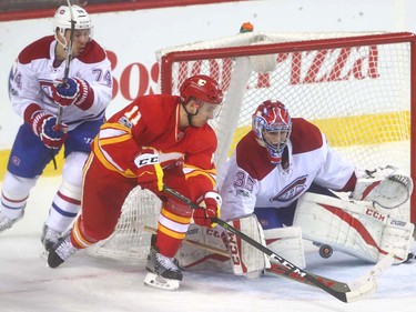Flames Mikael Backlund (C) drives to the net in front of Canadiens goalie Al Montoya during NHL action between the Montreal Canadiens and the Calgary Flames in Calgary, Alta. on Thursday March 9, 2017 at the Scotiabank Saddledome. Jim Wells/Postmedia