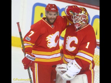 Flames TJ Brodie hugs goalie Brian Elliott after the win and Elliott's shut out following NHL action between the Montreal Canadiens and the Calgary Flames in Calgary, Alta. on Thursday March 9, 2017 at the Scotiabank Saddledome. The Flames are now undefeated in the last eight games.Jim Wells/Postmedia