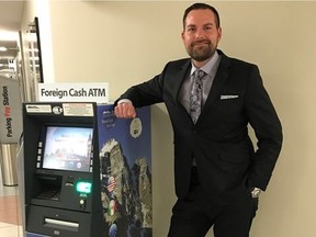 Derick Kachuik, vice-president of Olymia FX ATM and Olympia Trust's foreign exchange division, with one of the company's ATM machines that dispenses cash in foreign currencies.