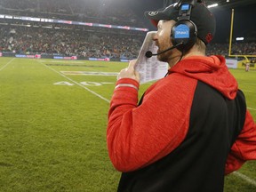 Coach Dave Dickenson of Calgary at the end of the game as Ottawa beat Calgary 39-33 with the 104th Grey Cup at BMO Field in Toronto, Ont. on Sunday November 27, 2016. Michael Peake/Toronto Sun/P81ostmedia Network