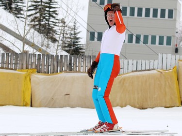 Michael Edwards best known as Eddie the Eagle celebrates after landing a jump in Calgary on Saturday March 5, 2017. The 1988 Olympian was ski jumping in support of local jumpers at Canada Olympic Park on Saturday March 5, 2017. About a 1000 fans watched Eddie jump. GAVIN YOUNG/POSTMEDIA NETWORK