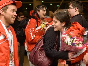 Team Canada's JorDen Tyson, centre, receives a welcome hug from her friend as she returns home after participating in the Special Olympics World Winter Games in Calgary on Saturday, March 25, 2017. The 11th Special Olympics were held in Graz and Schladming, Austria. This is the second time Austria has hosted the event, with the first time being in 1993. Pier Moreno Silvestri/Postmedia Network