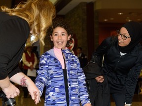 Director of Children's Wish Kyla Martin gives Lilyana El-Hajjar, 9, the news that her wish to go to Walt Disney World is being granted in Calgary on Tuesday, March 28, 2017. Lilyana was diagnosed with Acute Lymphoblastic Leukemia at the age of six. After invasive treatments she is now in remission and on course to make a full recovery. Pier Moreno Silvestri/Postmedia Network