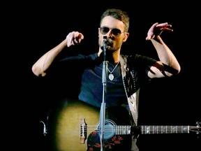 Heavy snowfall and the Saddledome roof's inability to handle a lot of additional weight forced Eric Church to deliver a stripped-down concert on Saturday. Reader says the compromise is proof of the need for a new arena.