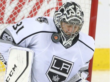 Los Angeles Kings goalie Ben Bishop stops a shot high on his neck during NHL action between the Los Angeles Kings and the Calgary Flames in Calgary on March 29, 2017.