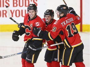 Flames forward Sean Monahan, Johnny Gaudreau and Matthew Tkachuk celebrates Monahan's second period goal during NHL action between the San Jose Sharks and the Calgary Flames in Calgary, Alta. on Friday March 31, 2017.
