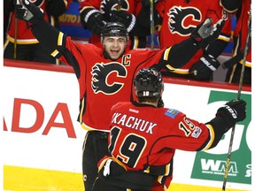 Flames Mark Giordano (5) celebrates his second period goal with teammate Matthew Tkachuk during NHL action in Calgary, Alta. between the Calgary Flames and the Dallas Stars at the Scotiabank Saddledome on Friday March 17, 2017.