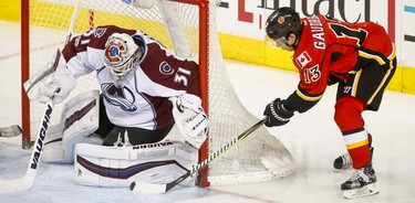 Johnny Gaudreau of the Calgary Flames tries a wraparound on Colorado Avalanche goalie Calvin Pickard during NHL action in Calgary, Alta., on Monday, March 27, 2017. He didn't score, but Micheal Ferland netted the rebound to put the Flames up 2-0. Lyle Aspinall/Postmedia Network