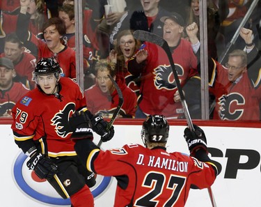 Calgary Flames Micheal Ferland, left, celebrates his goal on Colorado Avalanche with teammate Dougie Hamilton during their game at the Scotiabank Saddledome in Calgary, Alta., on Monday March 27, 2017. Leah Hennel/Postmedia