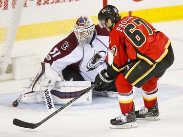Michael Frolik of the Calgary Flames can't score on Colorado Avalanche goalie Calvin Pickard during NHL action in Calgary, Alta., on Monday, March 27, 2017. The Flames won 4-2.