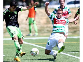 Foothills FC Tyrin Hutchings battles Seattle Sounders FC Guillermo Delgado in U-23 action at Hellard Field in Calgary on June 28, 2015. (File)