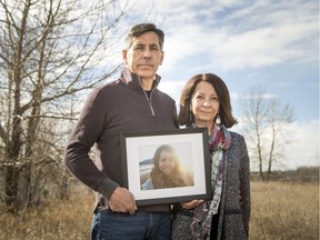 Dan and Brenda Lavallee hold a photo of their daughter Jillian near their home by the Bow River in Calgary, Alta., on Thursday, March 30, 2017. Jillian ws killed by a drunk driver in 2015, and the Lavallees have since become spokespeople for Mothers Against Drunk Driving. Lyle Aspinall/Postmedia Network