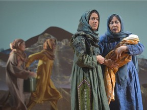 (front l to r) Nadine Malouf (Laila) and Kate Rigg (Mariam) in Theatre Calgary and San Francisco's American Conservatory Theater's A Thousand Splendid Suns.   Photo by Kevin Berne.