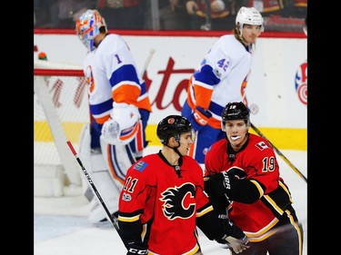Calgary Flames Mikael Backlund and Matthew Tkachuk celebrate after the teams second goal against the New York Islanders during NHL hockey in Calgary, Alta., on Sunday, March 5, 2017. AL CHAREST/POSTMEDIA