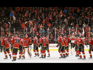 The Calgary Flames salute the fans after beating the New York Islanders in NHL action in Calgary, Alta., on Sunday, March 5, 2017. The Flames won 5-2, marking their seventh straight win. Lyle Aspinall/Postmedia Network