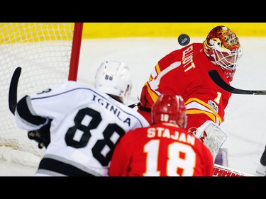 Calgary Flames Brian Elliott with a save against Jarome Iginla  and Los Angeles Kings during NHL hockey in Calgary, Alta., on Sunday, March 19, 2017. AL CHAREST/POSTMEDIA