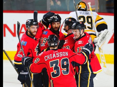 Calgary Flames Matt Stajan celebrates with teammates after scoring on Marc-Andre Fleuryof the Pittsburgh Penguins during NHL hockey in Calgary, Alta., on Monday, March 13, 2017. AL CHAREST/POSTMEDIA