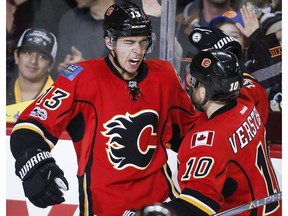 Calgary Flames winger Johnny Gaudreau (13) celebrates his goal with Kris Versteeg (10) against the Pittsburgh Penguins in Calgary on Monday, March 13, 2017. (The Canadian Press)