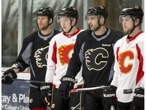 Dennis Wideman, left, Curtis Lazar, Mark Giordano and Sam Bennett watch a drill during Calgary Flames practice at Winsport in Calgary on Thursday, March 2, 2017. (Lyle Aspinall)