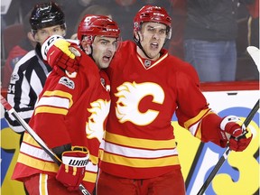 Calgary Flames captain Mark Giordano, left, celebrates his goal against the Los Angeles Kings with teammate Mikael Backlund in Calgary on March 19, 2017. (The Canadian Press)