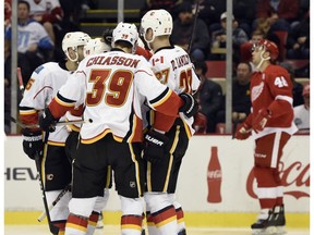 The Calgary Flames celebrate a goal by center Matt Stajan against the Detroit Red Wings in Detroit, Nov. 20, 2016. The Flames defeated the Red Wings 3-2. (AP Photo)
