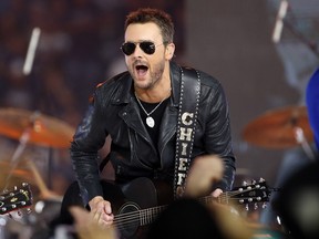 Country music singer Eric Church performs at halftime during an NFL football game between the Washington Redskins and Dallas Cowboys in Arlington, Texas.