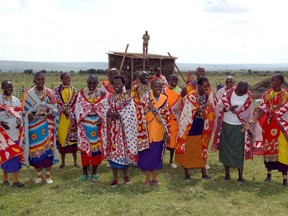 FILE PHOTO: Villagers gather to inaugurate their new well in Narok, Kenya. The well is part of Operation Eyesight's trachoma control program for the district. Clean water is crucial to the eradication of trachoma, one of the world's leading causes of blindness.