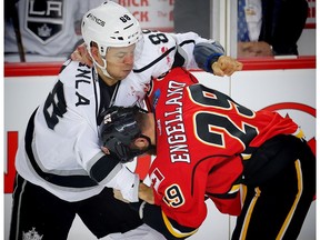Calgary Flames' Deryk Engelland fights Jarome Iginla of the Los Angeles Kings in Calgary on Wednesday, March 29, 2017. (Al Charest)