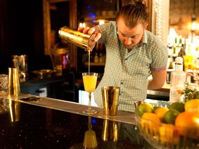 Untitled Champagne Lounge bartender Shelby Goodwin mixes a Champagne Mai Tai, a fizzy twist on the original tiki drink.