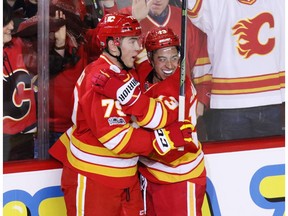 Calgary Flames Micheal Ferland and Johnnie  Gaudreau celebrate Ferland's goal on Montreal Canadiens goaltender Al Montoya during NHL action at the Scotiabank Saddledome on Thursday March 9, 2017.