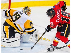 Pittsburgh Penguins goalie Marc-Andre Fleury makes a save on a shot by Matthew Tkachuk of the Calgary Flames in Calgary on Monday, March 13, 2017. (Al Charest)