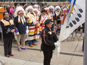 Calgary Mayor Naheed Nenshi and Treaty 7 Chiefs watch the raising of the Treaty 7 flag at City Hall on Thursday March 23, 2017.